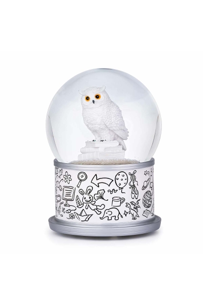Boule à neige Harfang des neiges avec chouette blanche posée sur une pile de livres