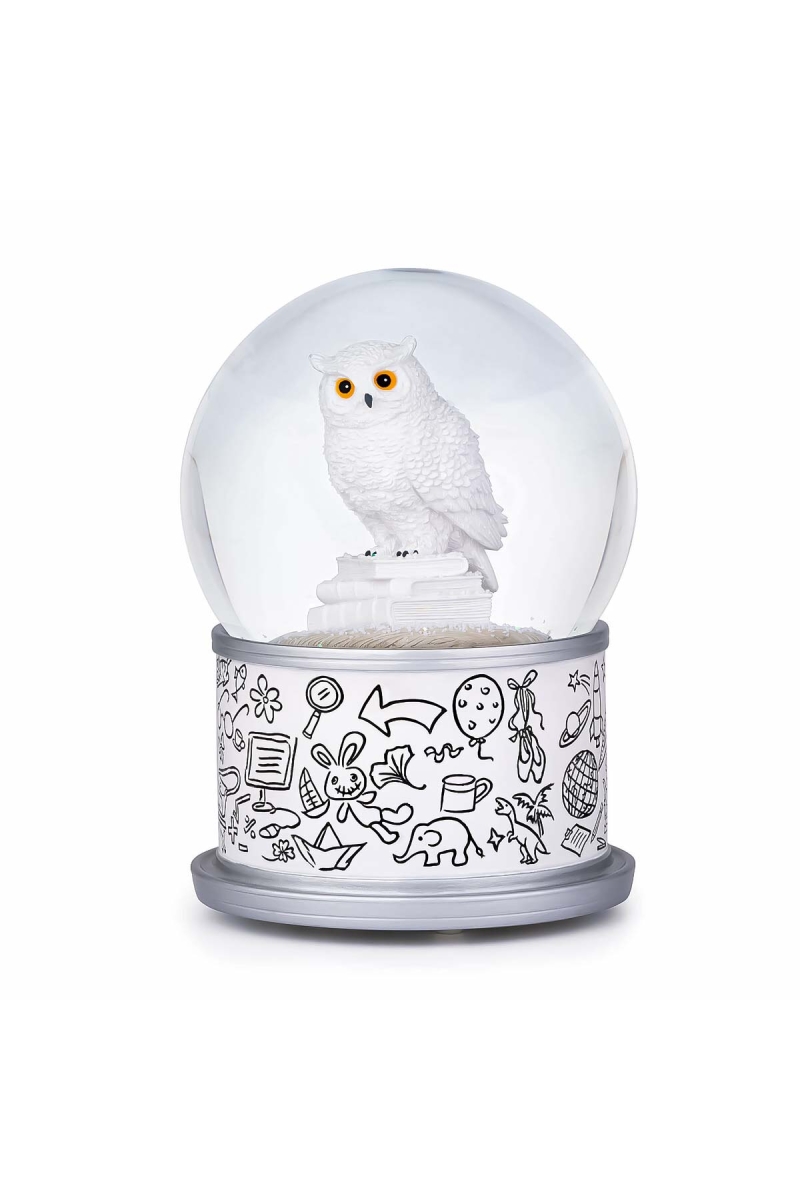 Boule à neige Harfang des neiges avec chouette blanche posée sur une pile de livres